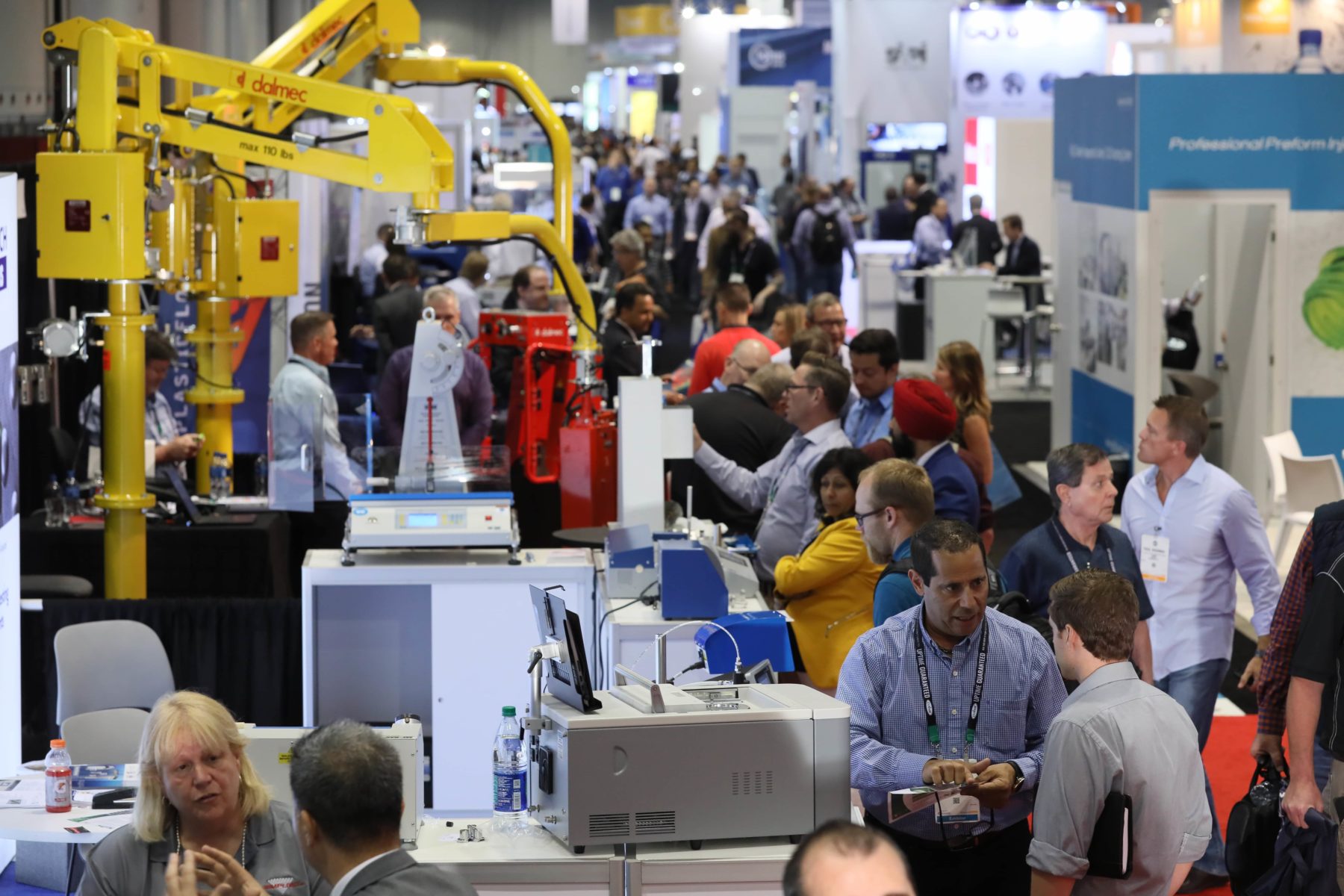 Attendees at NPE2018 survey the exhibits on the show floor